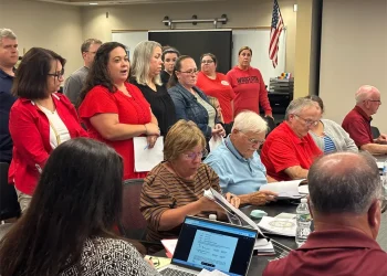 Group of people presenting a petition to the Bay Path Regional Vocational Technical High School School Committee